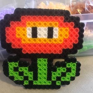 handmade keychain by a 4 year old boy trying to make summer money !